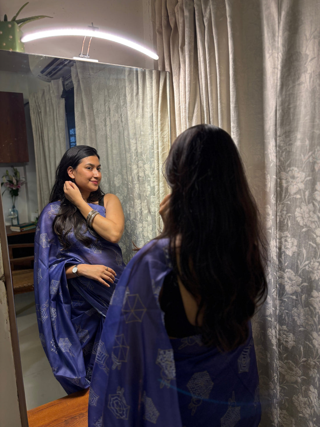 Indian woman wearing a saree confidently at work