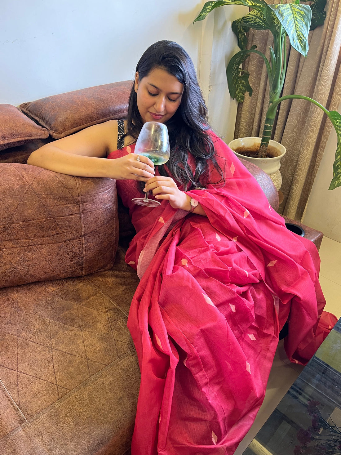 Woman confidently wearing a cotton or linen saree