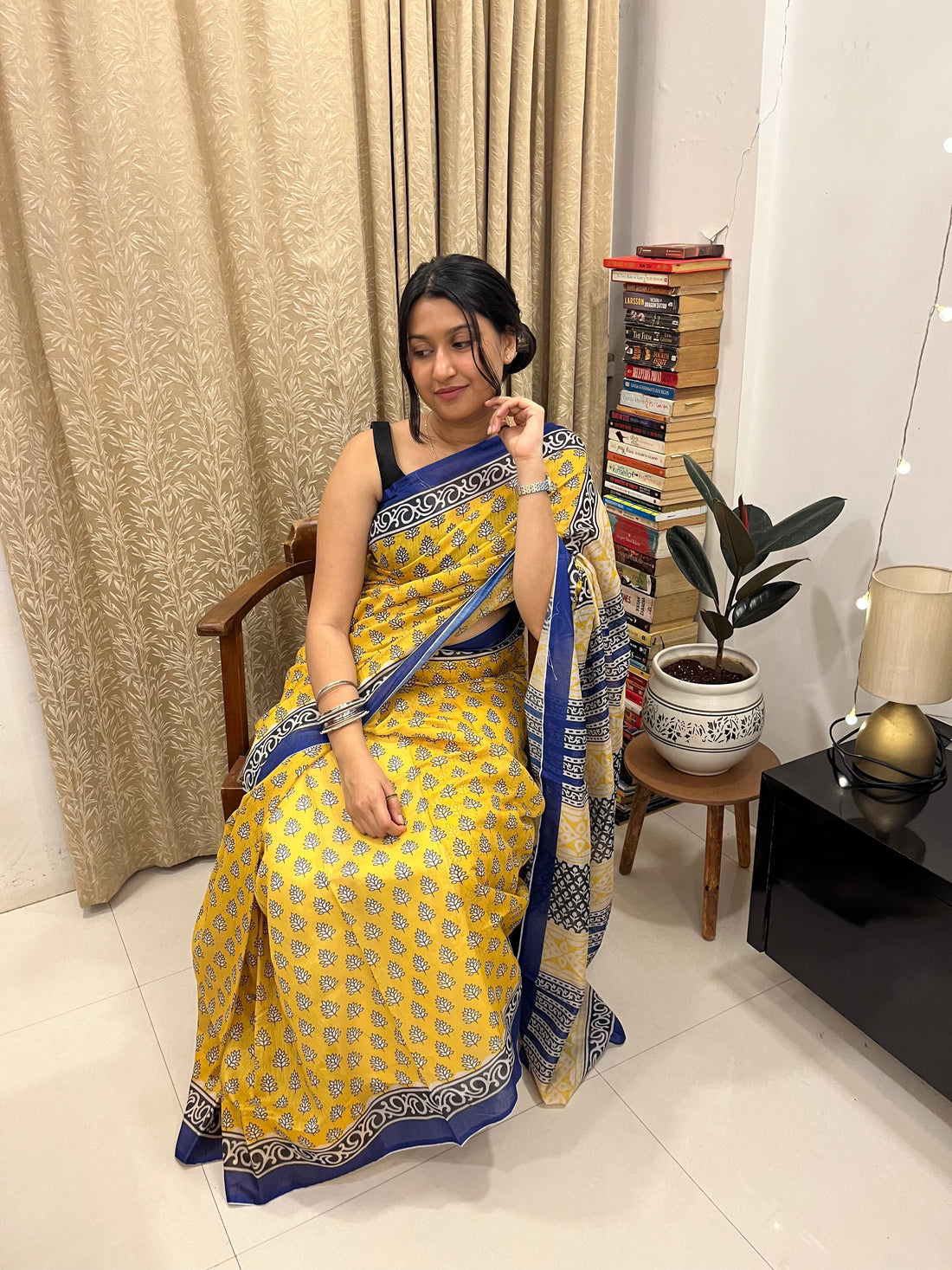 Woman wearing a linen saree styled for office meeting