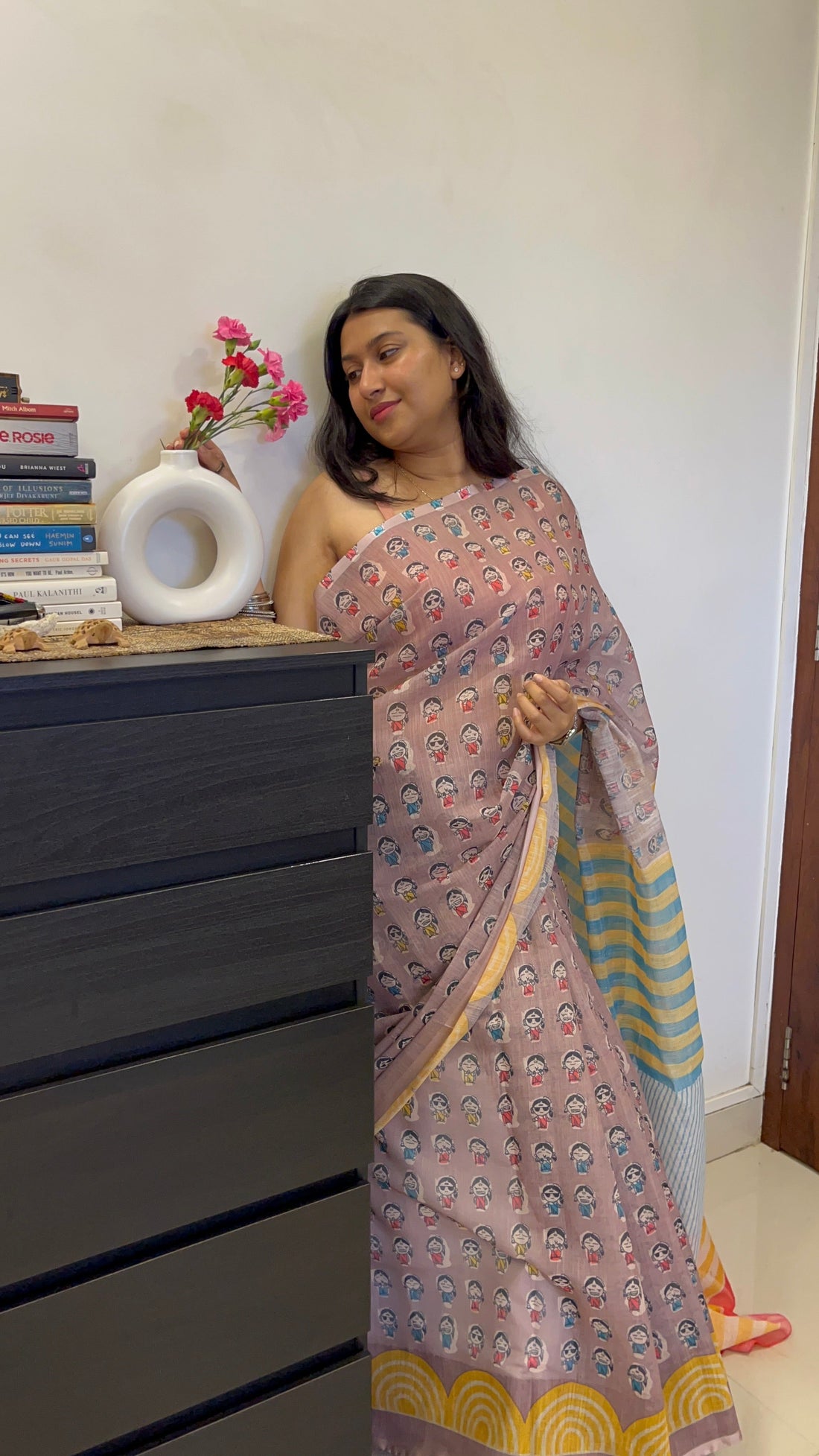 Pregnant woman wearing a linen saree with a relaxed drape