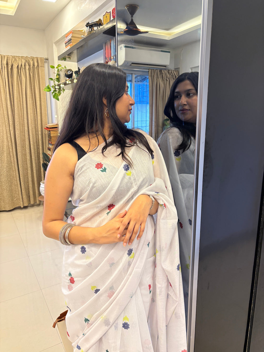 Woman wearing a cotton saree comfortably in summer