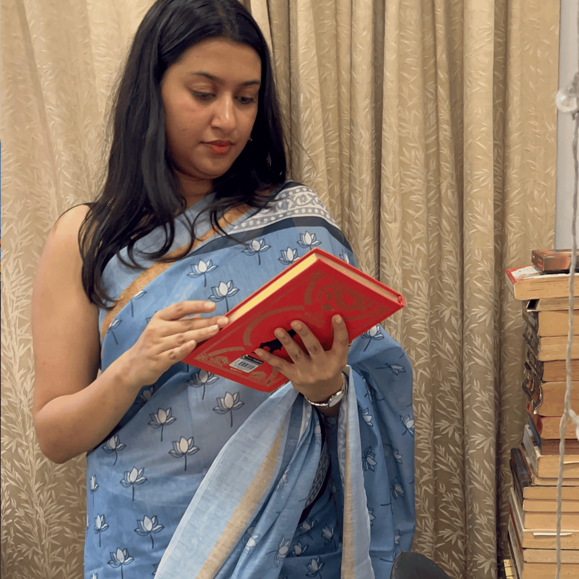 Women in blue cotton saree. Lotus cotton saree. cotton sari blue in colour.